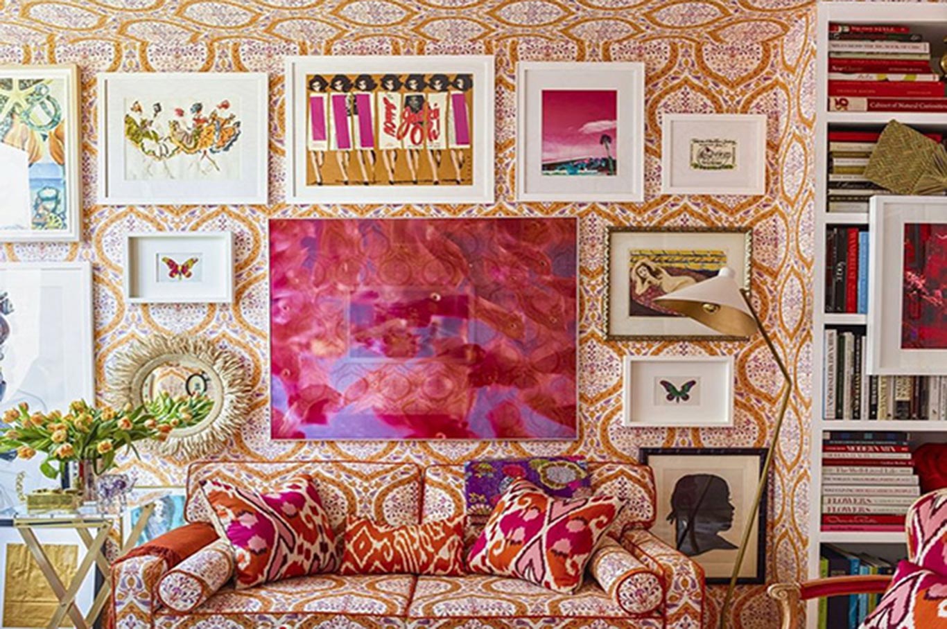 Boho space is accessorized by many patterns and vintage paintings.