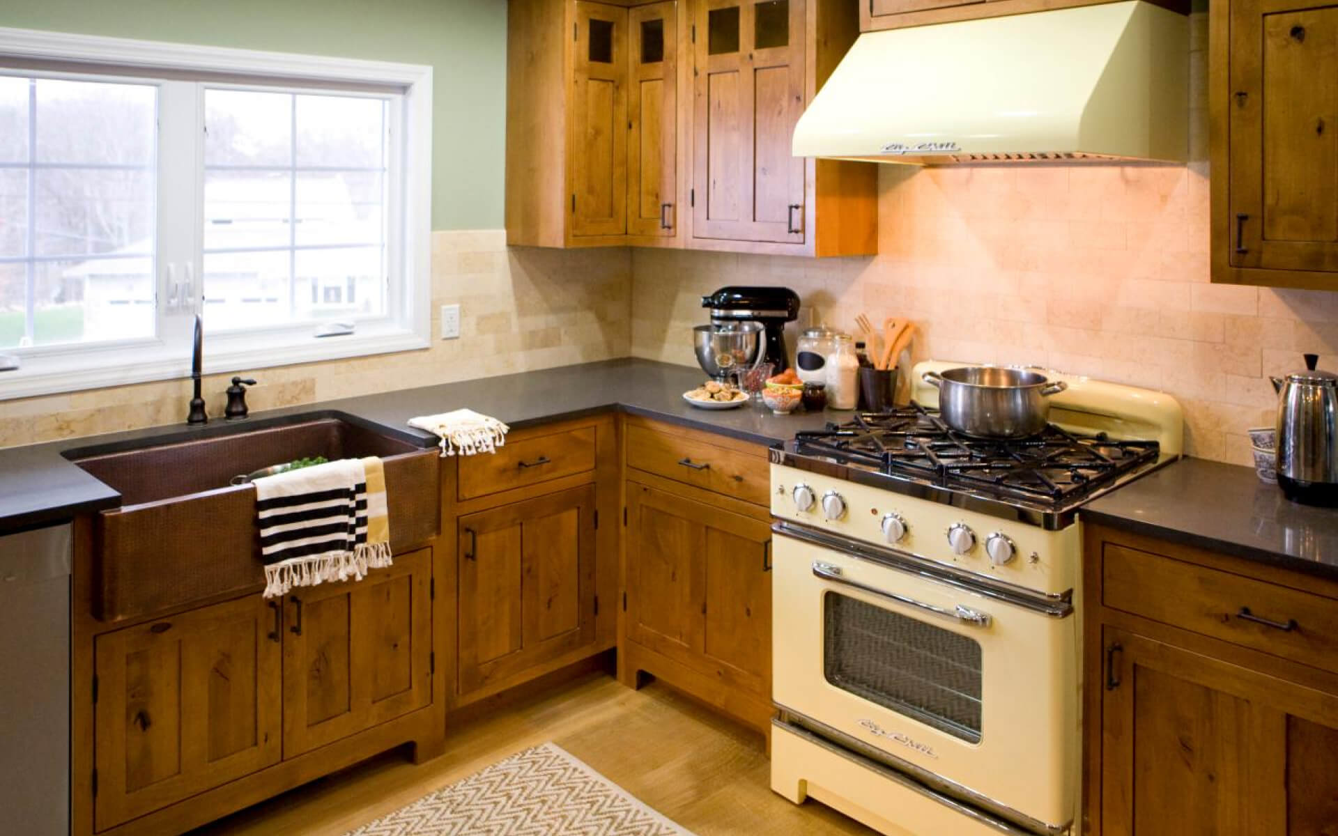 Large wooden cabinets align with a farmhouse-styled home.