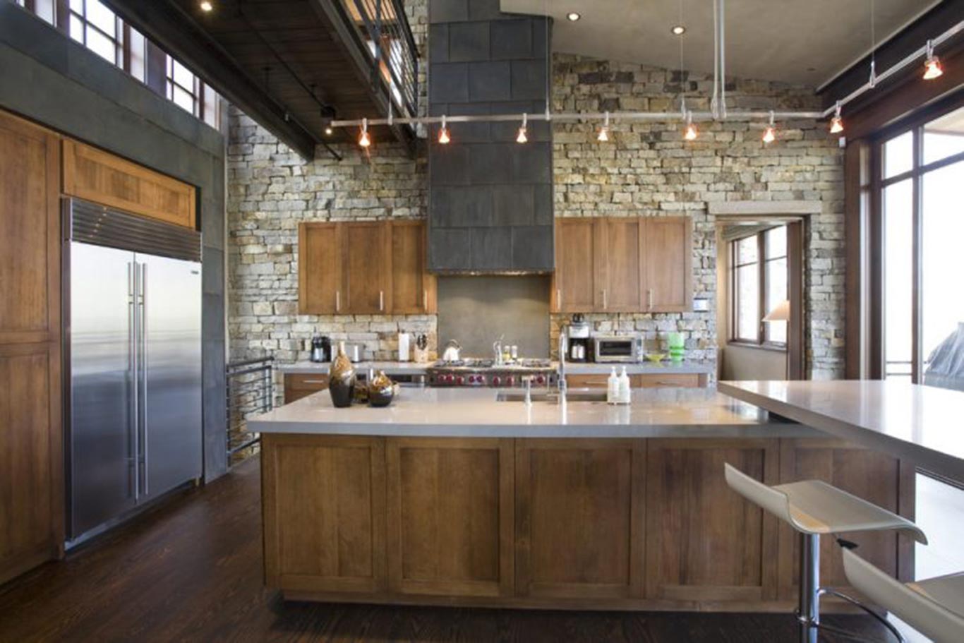 Wooden accents through cabinetry, chairs and dining table against bricks in its natural, unpainted state