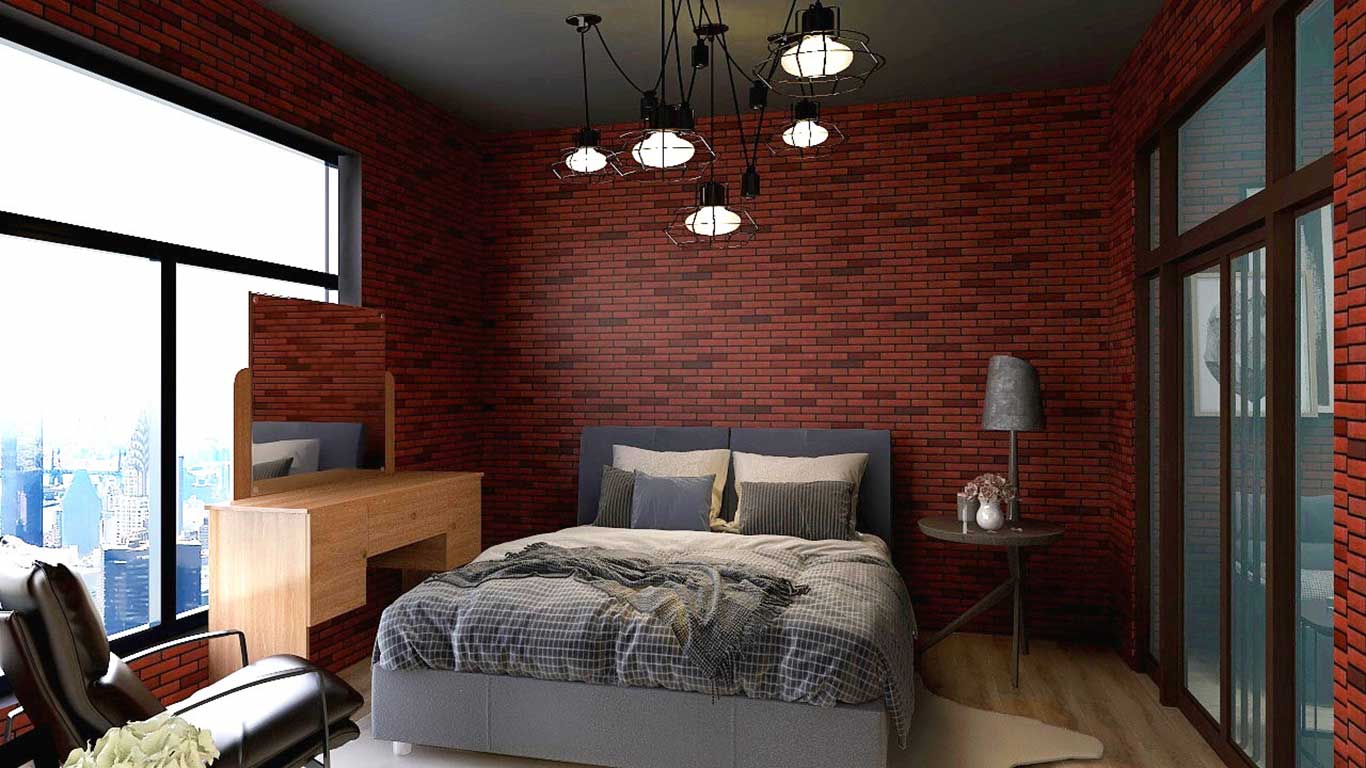 Fabric upholstered bed frame and bedding in monochromatic gray hues blend amiably against bold red brick walls