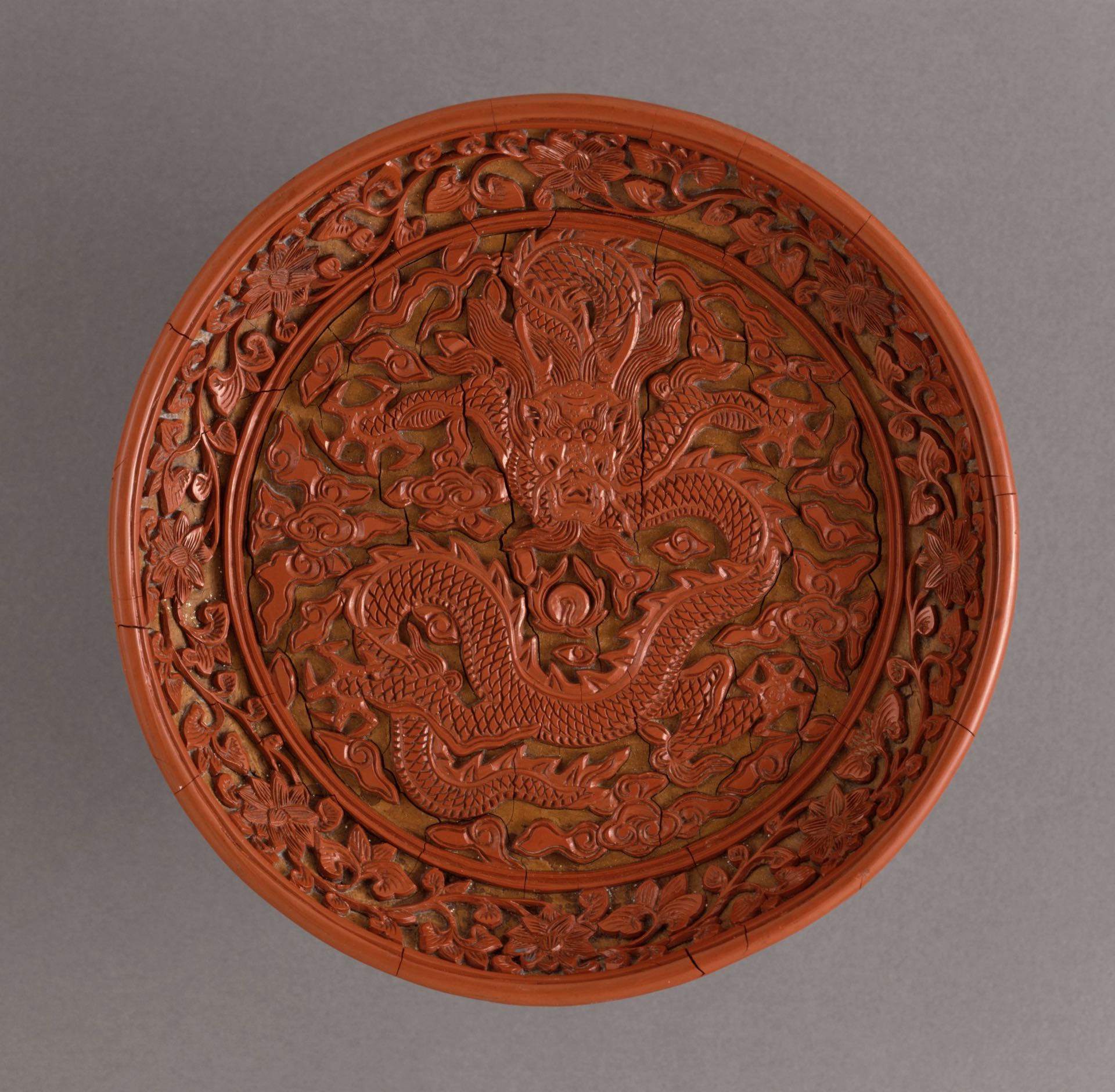 Lacquered ancient Chinese bowl with intricate dragon design