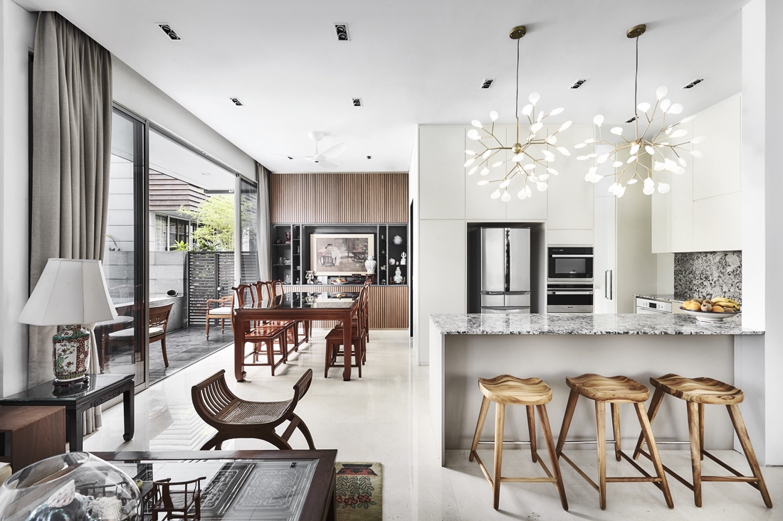 Open concept terrace home kitchen and dining area utilizing Oriental Chinese furniture and decor