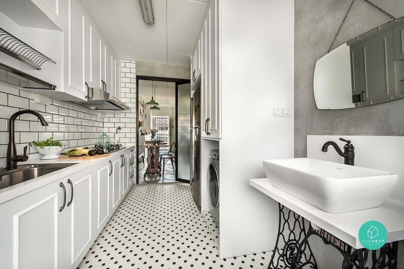 Modern fixtures complemented with 60s polka-dotted mosaic flooring in a galley kitchen