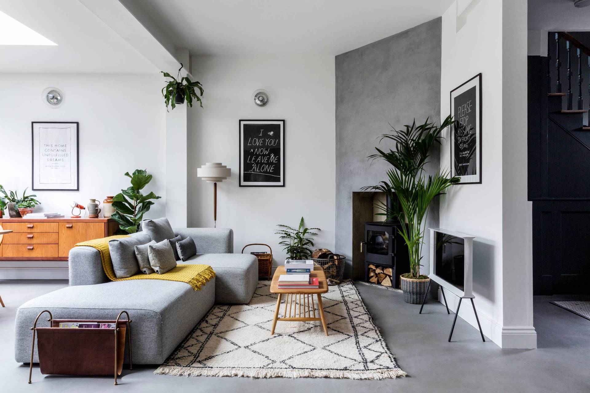 A well-balanced mix of modern wood and gray hue decor in a warm and inviting Scandinavian space