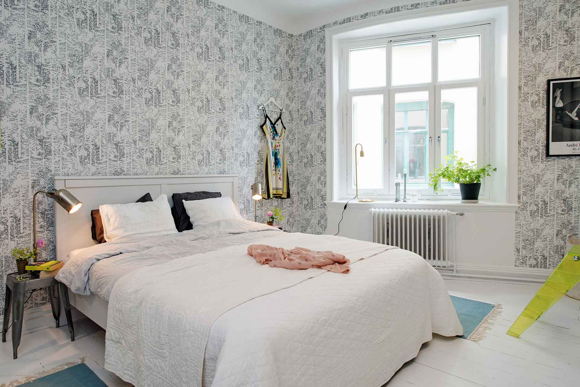 Decors are kept light and muted around the textured walls of a Scandinavian HDB master bedroom