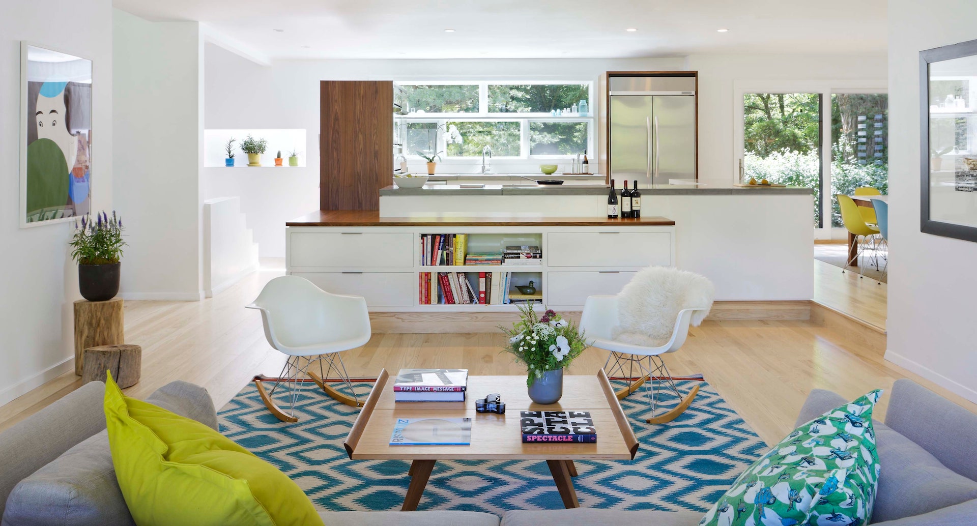 A modern Scandinavian style of wooden and white furniture accents in a living room of a terrace house